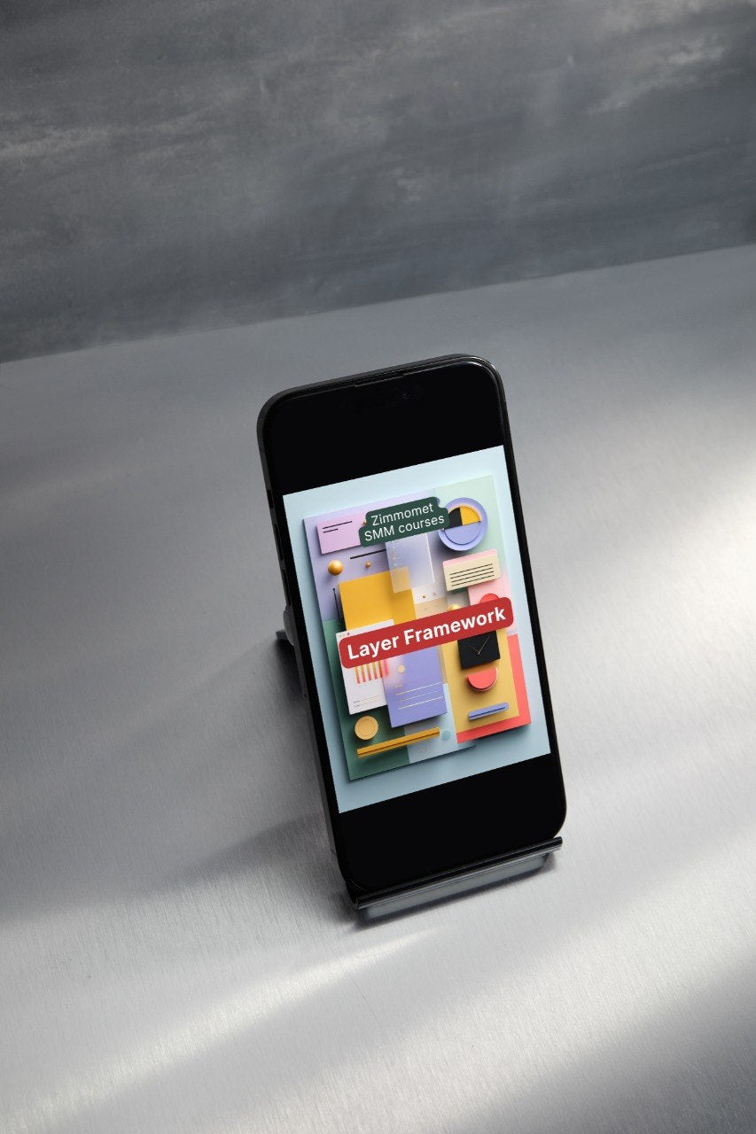 Smartphone on a stand displaying a colorful app interface on a gray surface.